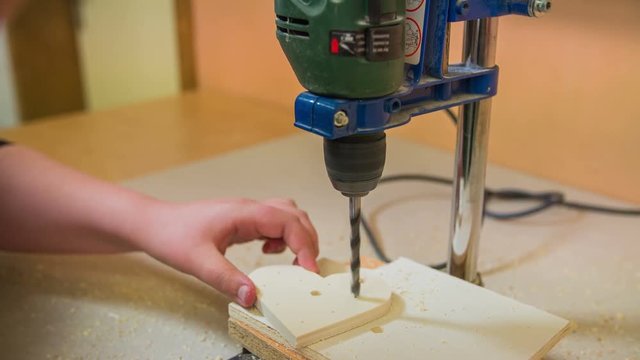 Drilling machine making holes in heart