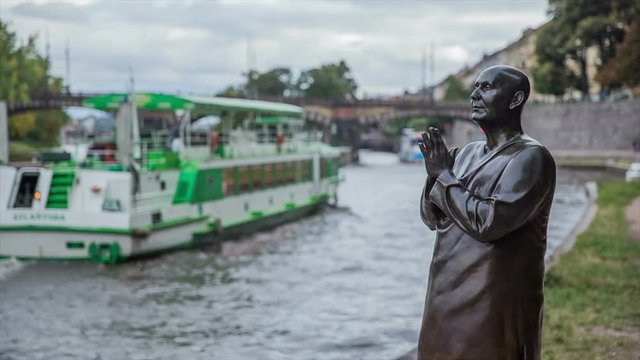 Iron Buddhist monk statue praying on Vltava river