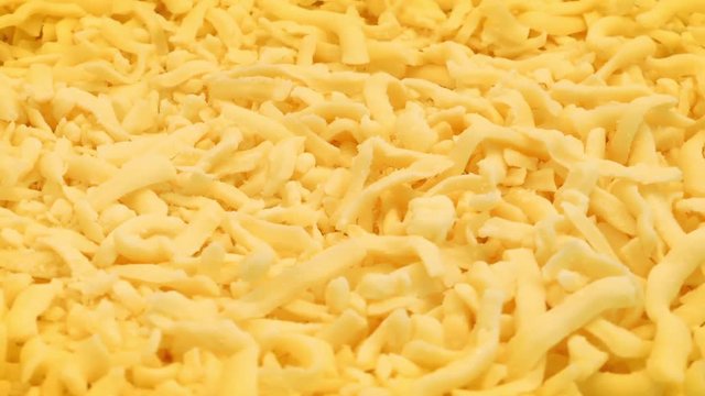 Grated Cheese Rotating On Plate