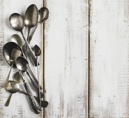 Vintage spoons on wooden background