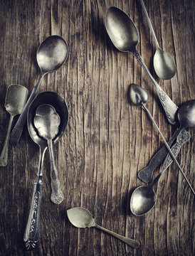 Vintage spoons on wooden background