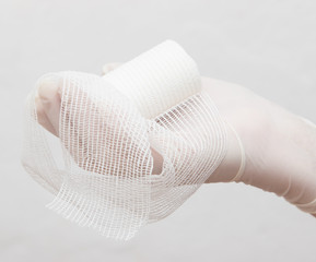 medical bandage in his hand