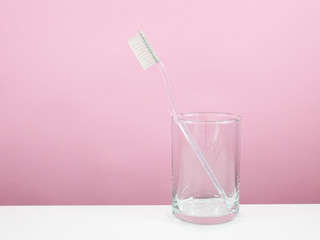 The clear toothbrush with small glass for brushing the teeth.
