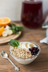 Healthy and wholesome breakfast. Yogur with muesli and currants
