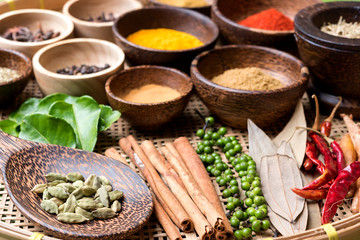 mix asian herbs in the wood bowl  on the bamboo basket