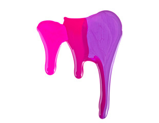 Close up of spilled colorful nail polish on a white background