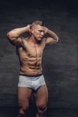 Fototapeta premium Abdominal shirtless man in a white panties.