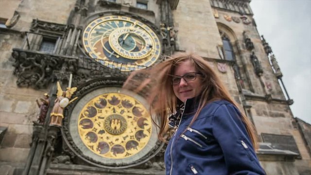 Woman portrait shot in front Prague astronomical clock