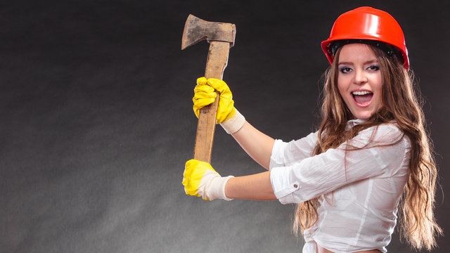 Sexy strong woman feminist with axe working.