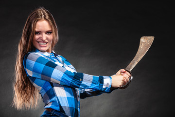 Pretty strong woman holding machete.