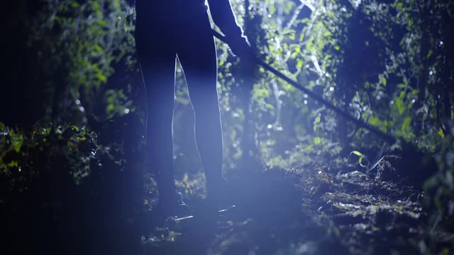 Person walk on garden and start hoeing