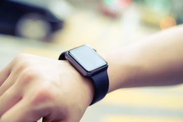 Man using smart watch at outdoor