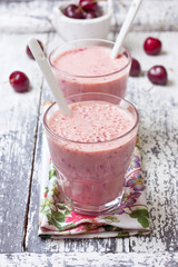 smoothie with cherry in a glass