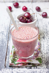 smoothie with cherry in a glass