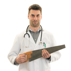 Crazy doctor is holding a big saw in his hands