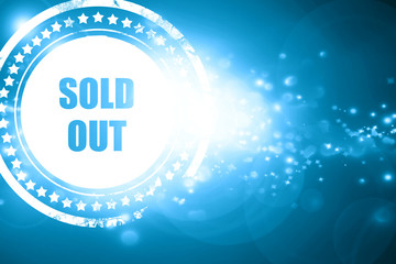 Blue stamp on a glittering background: sold out sign