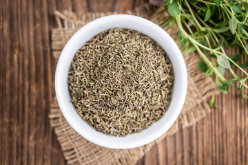 Dried Thyme on wooden background