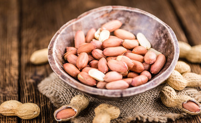 Some fresh Peanuts on wooden background