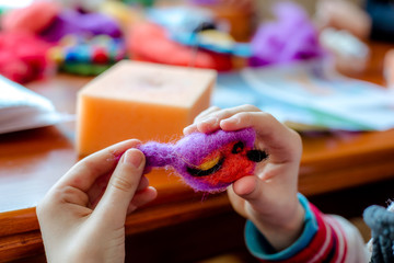 Manufacturing process from wool soft toys. Felting activity