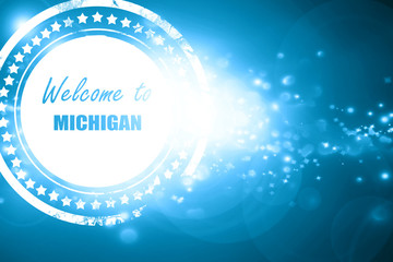 Blue stamp on a glittering background: Welcome to michigan