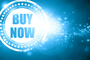 Blue stamp on a glittering background: buy now sign
