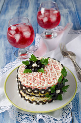 Salad with crab sticks, cheese, egg and prunes