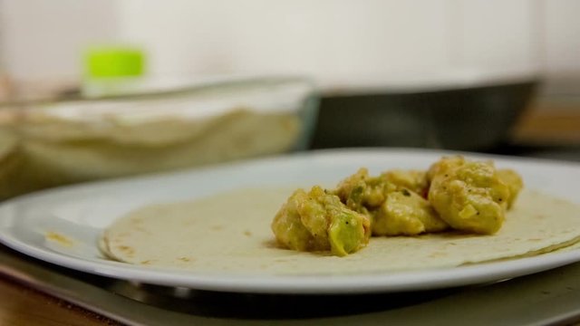 Making Mexican tortilla rollups close up