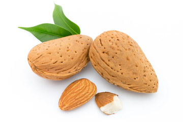 Almonds with leaves isolated on white background