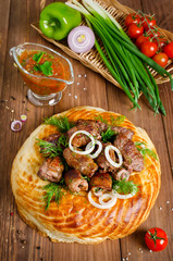 Lamb rolls with cilantro and purple onion in a tortilla