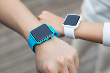 Couple using smart watch together