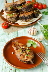 Steaks of carp in bread crumbs and spices