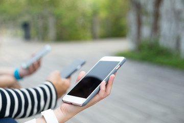 Group of people using cellphone together