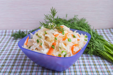 Cabbage pickling acid in a blue bowl with herbs