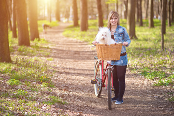 Beauty woman and her dog in the park