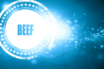 Blue stamp on a glittering background: Delicious beef sign