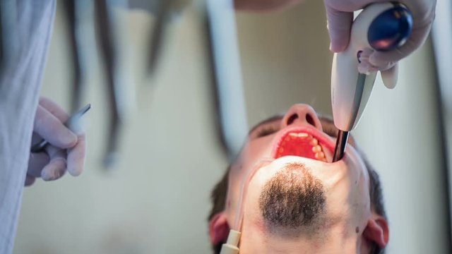 UV light inside patient mouth at dentist