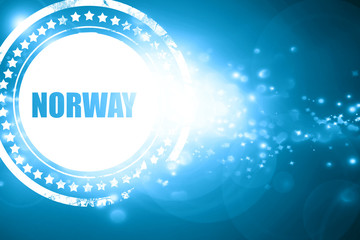 Blue stamp on a glittering background: Greetings from norway