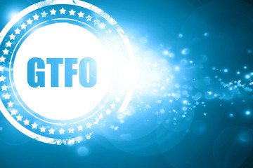 Blue stamp on a glittering background: gtfo internet slang