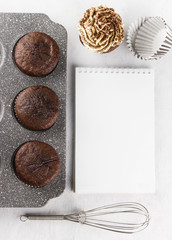 Pastry cakes : chocolate muffins with cream. Space for text