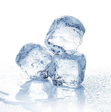 Three melting ice cubes on white background.