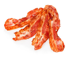 Cooked bacon rashers close-up isolated on a white background.