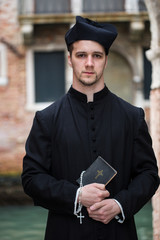 young priest in venice