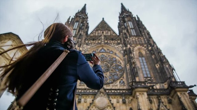 Woman take picture of Prague Vitus Cathedral
