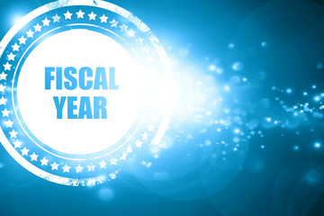 Blue stamp on a glittering background: fiscal year