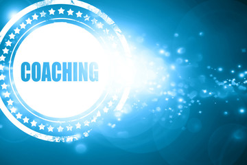 Blue stamp on a glittering background: coaching