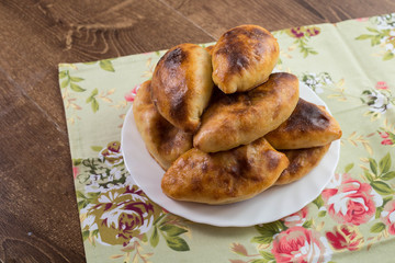 Russian patties with cabbage on a dish and beautiful background