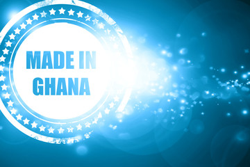 Blue stamp on a glittering background: Made in ghana