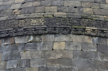Stone bas-relief on the wall of Borobudur, Java, Indonesia