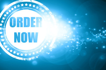 Blue stamp on a glittering background: Order now sign