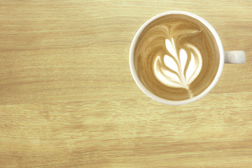 Latte coffe with wooden texture for background